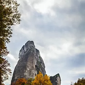Rugged Cliffs, Road And Autumn Foliage; Meteora, Greece