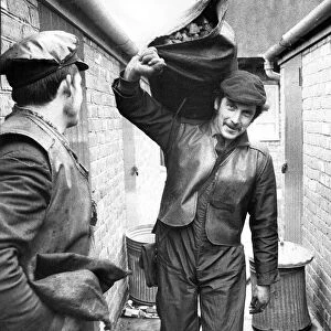 A coalman delivering coal. 27th January 1972