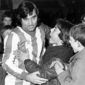 George Best meets the fans in the No. 7 Nuneaton Borough shirt