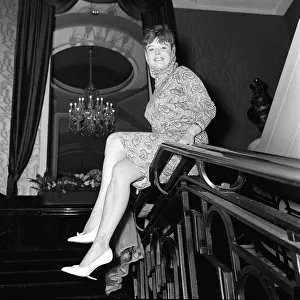 Janet Munro actress sitting on banisters at a rehearsal for the Royal Film Performance