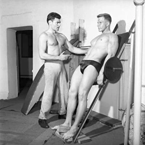 Mens Health: Body builder Larry Stevens seen here with his training coach exercising