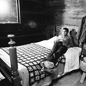 Muhammad Ali relaxing in Deer Lake Pennsylvania. January 1974