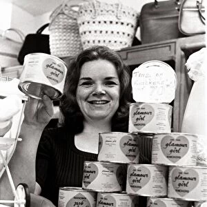 Salesgirl Delia Dixon showing off some of the tinned knickers she has on sale in her shop