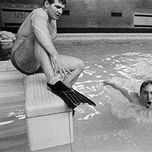 Swimmer Bobby Lord (in pool) with coach Graham Symonds. 8th November 1965