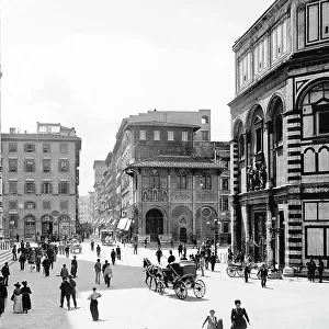 Passers-by and carriages in Piazza Duomo, Florence