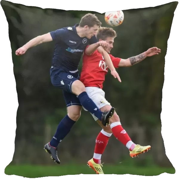 Bristol City vs Millwall: Intense Aerial Battle between Ben Withey and Keaton Wood