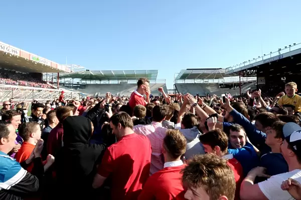 Bristol City Crowned Champions: Euphoric Fans Invade Pitch