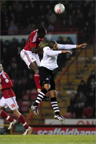 Battling for Supremacy: Damion Stewart vs Luke Moore in the Championship Clash between Bristol City and Swansea City (01 / 02 / 2011)