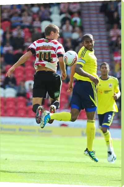 Battling for Supremacy: Marvin Elliott vs. Tommy Spurr in Doncaster Rovers vs. Bristol City (League Cup, 2011)