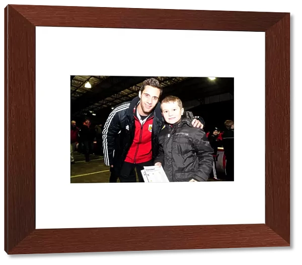 Bristol City's Sam Baldock and Young Fan Share a Moment at Ashton Gate during Bristol City vs Leicester City (January 12, 2013)