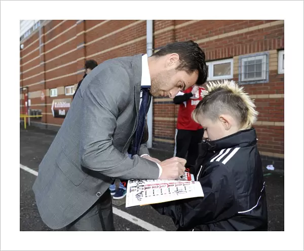Bristol City's Sam Baldock Brings Smiles to a Young Fan with Autographed Programme