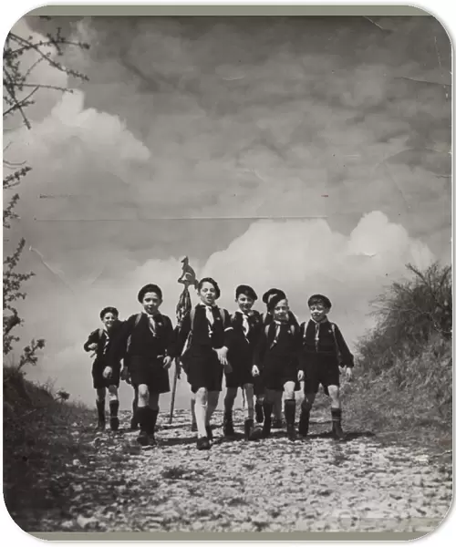 French cub scouts walking along a country lane
