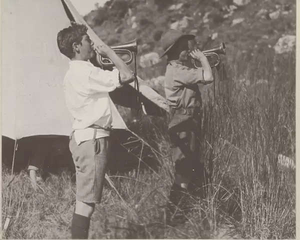 Two boy scout buglers at camp