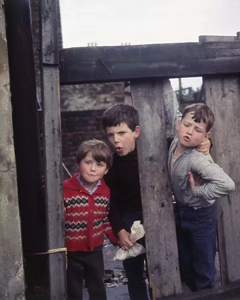 Three boys playing on a Balham street, SW London