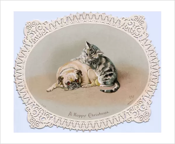 Kitten and dog on a cutout Christmas card