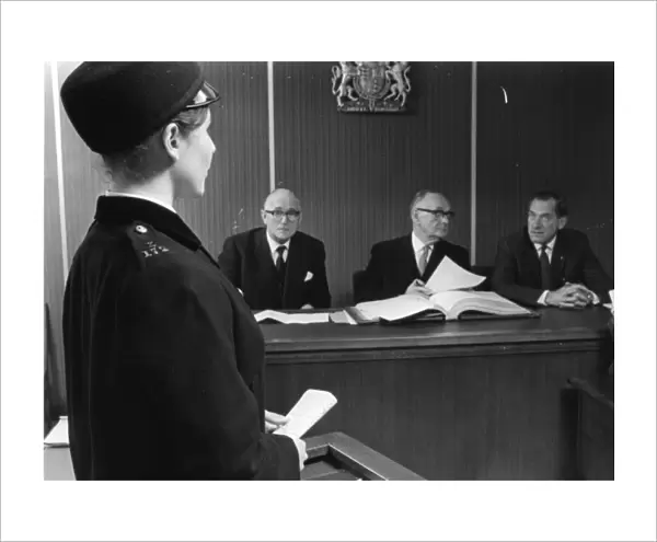 Woman police officer giving evidence in court, London