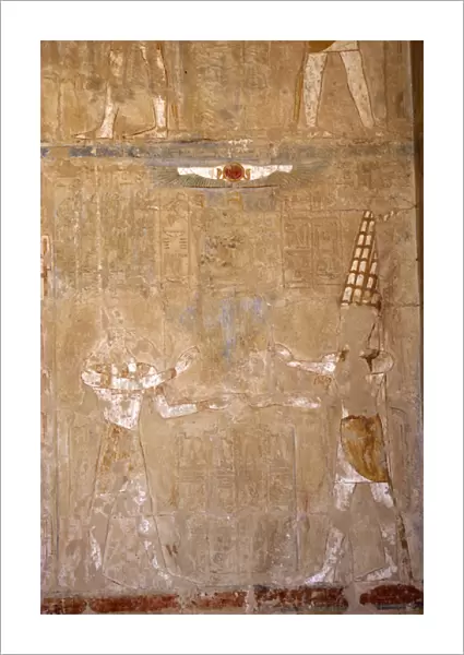 God Anubis (jackal-face) and god Amon (feather headdress). T