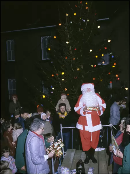 Father Christmas with tree and presents