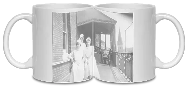 Three nurses on balcony, Bury St Edmunds Hospital