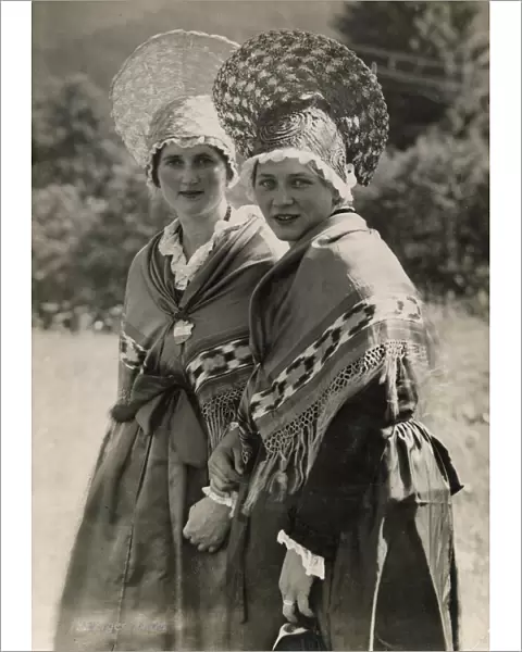 Two Swiss girls wearing traditional Zurich peasant costumes including shawls