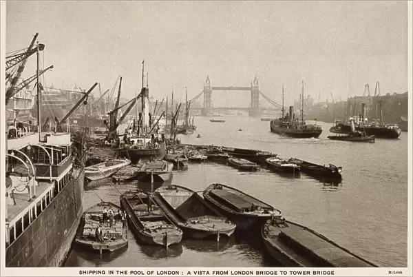 Shipping on the River Thames, London, view from London Bridge looking towards Tower