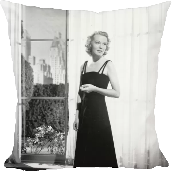 An evening dress for Rita Johnson in Manproof (1938)