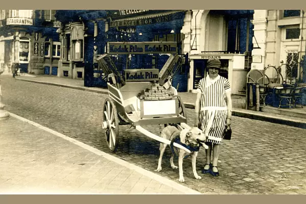 Dog cart with Kodak Girl in striped dress