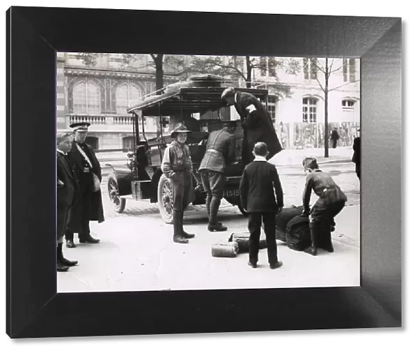 WWI: unloading Red Cross supplies from a car, Paris
