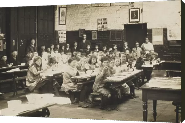 Classroom scene, with pupils eating at their desks