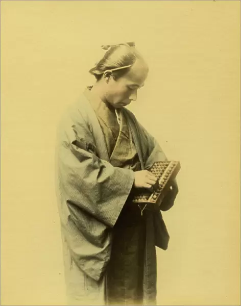 Japanese man counting on an abacus