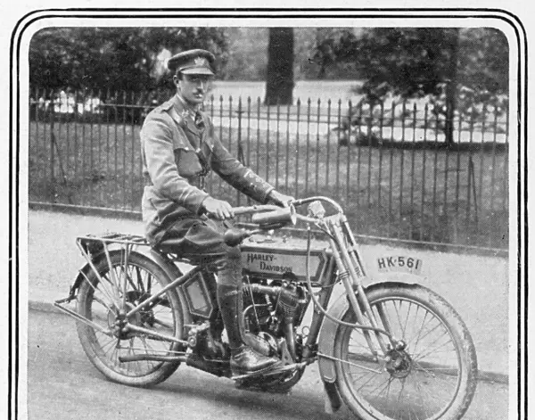 An army officer sits astride a Silent Grey Harley Davidson