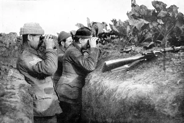 Looking for the daring German sniper: British soldiers engaged in locating one of the enemys sharpshooters