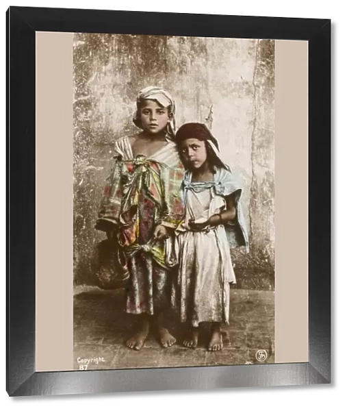 Two young Tunisian beggar children