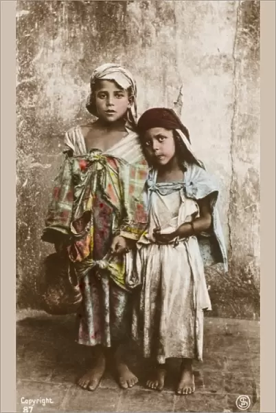 Two young Tunisian beggar children