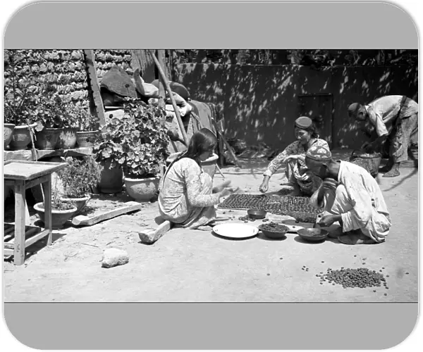 People preparing food, Kashgar, western China