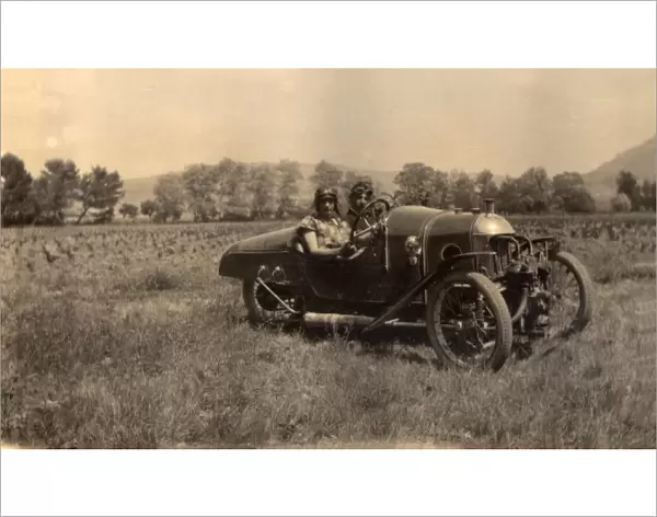Two chaps in a sporty 20s motor