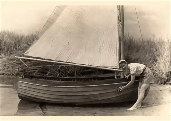 Woman washing down boat