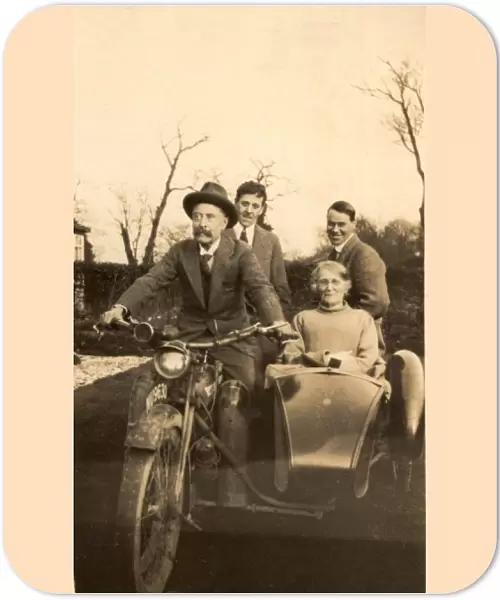 Elderly couple in motorbike and sidecar