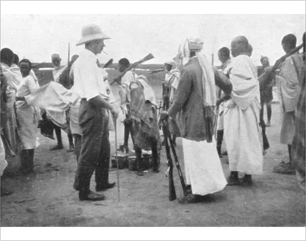 Richard Corfield distributing arms at Burao Fort