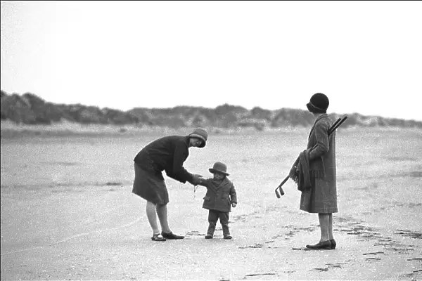 Two women and a child on the beach, Devon