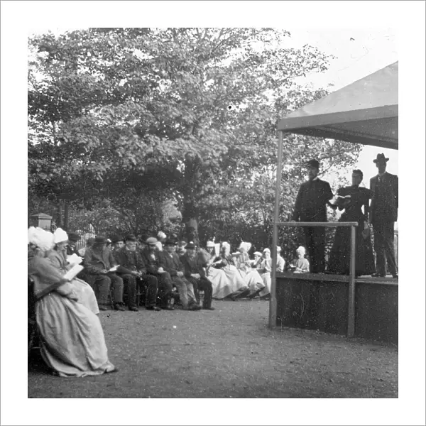 Open air church service at a workhouse