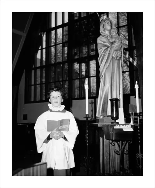 Choirboy singing solo in a church, Horley, Surrey