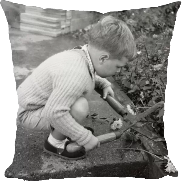 Little boy with garden shears