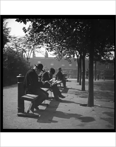 Men on benches in a London park
