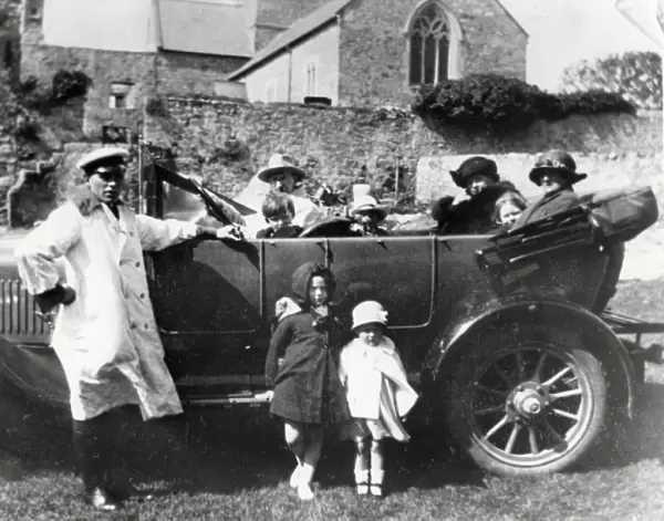 Family car with passengers and chauffeur, South Wales