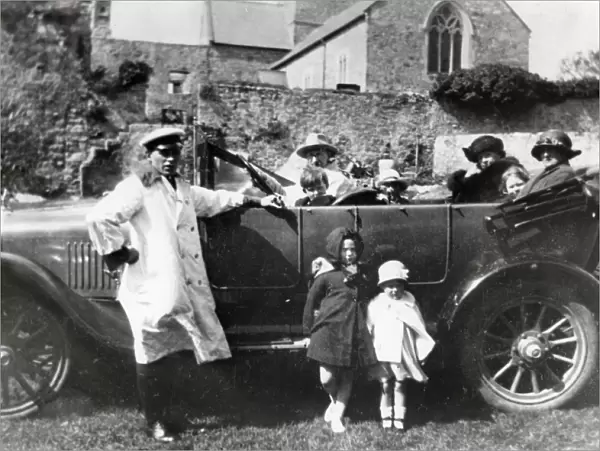 Family car with passengers and chauffeur, South Wales