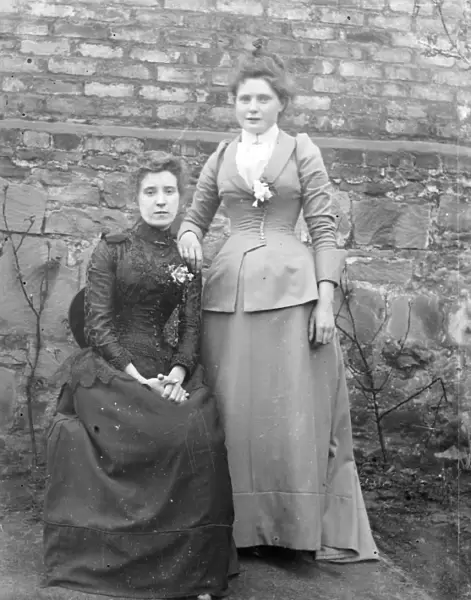 Two sisters in a garden, Mid Wales