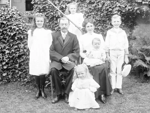 Middle class family group in a garden, Mid Wales