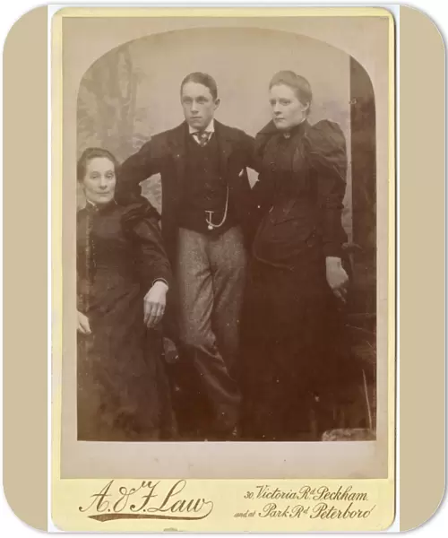 Two Victorian sisters and their brother in studio setting