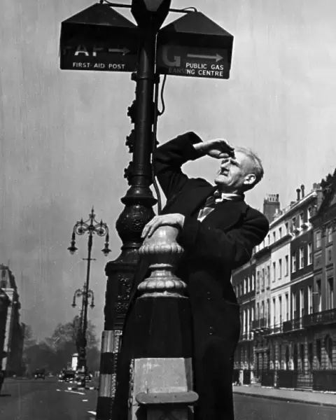 Man examining street signs